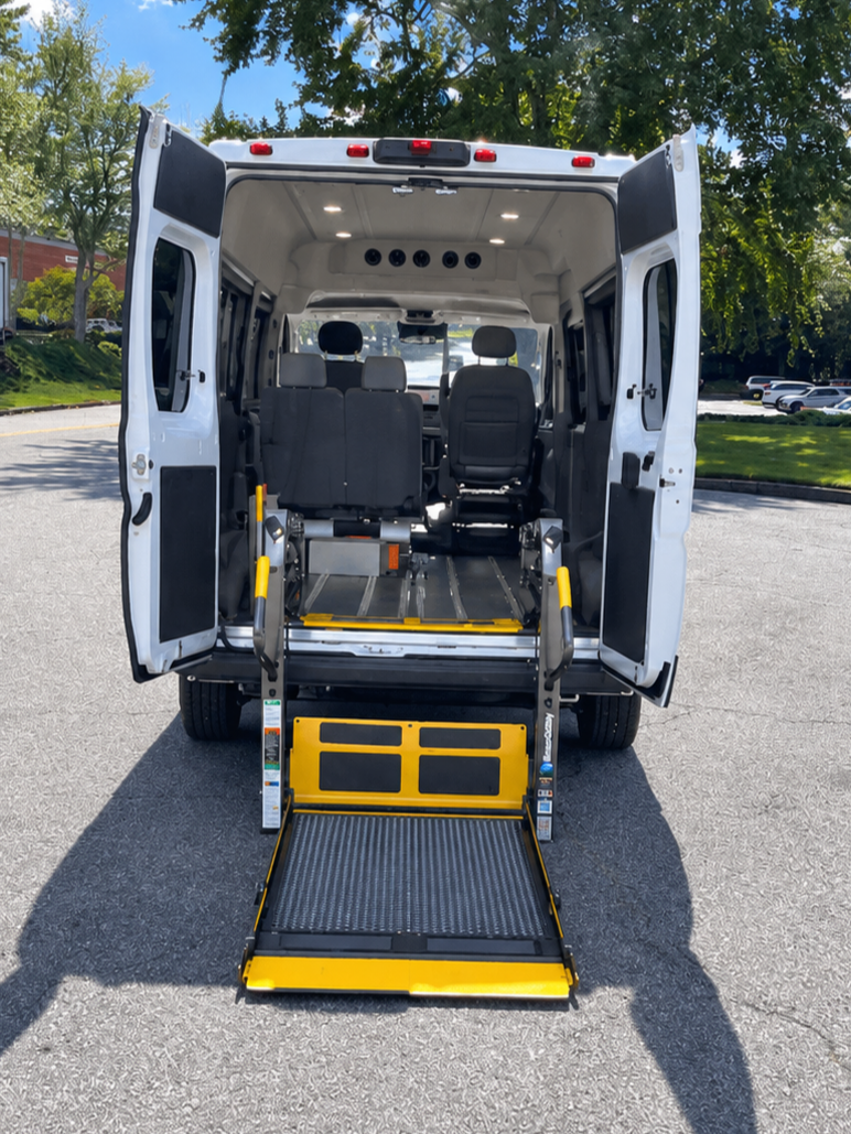 Rear of an HMR wheelchair-accessible vehicle with the lift deployed
